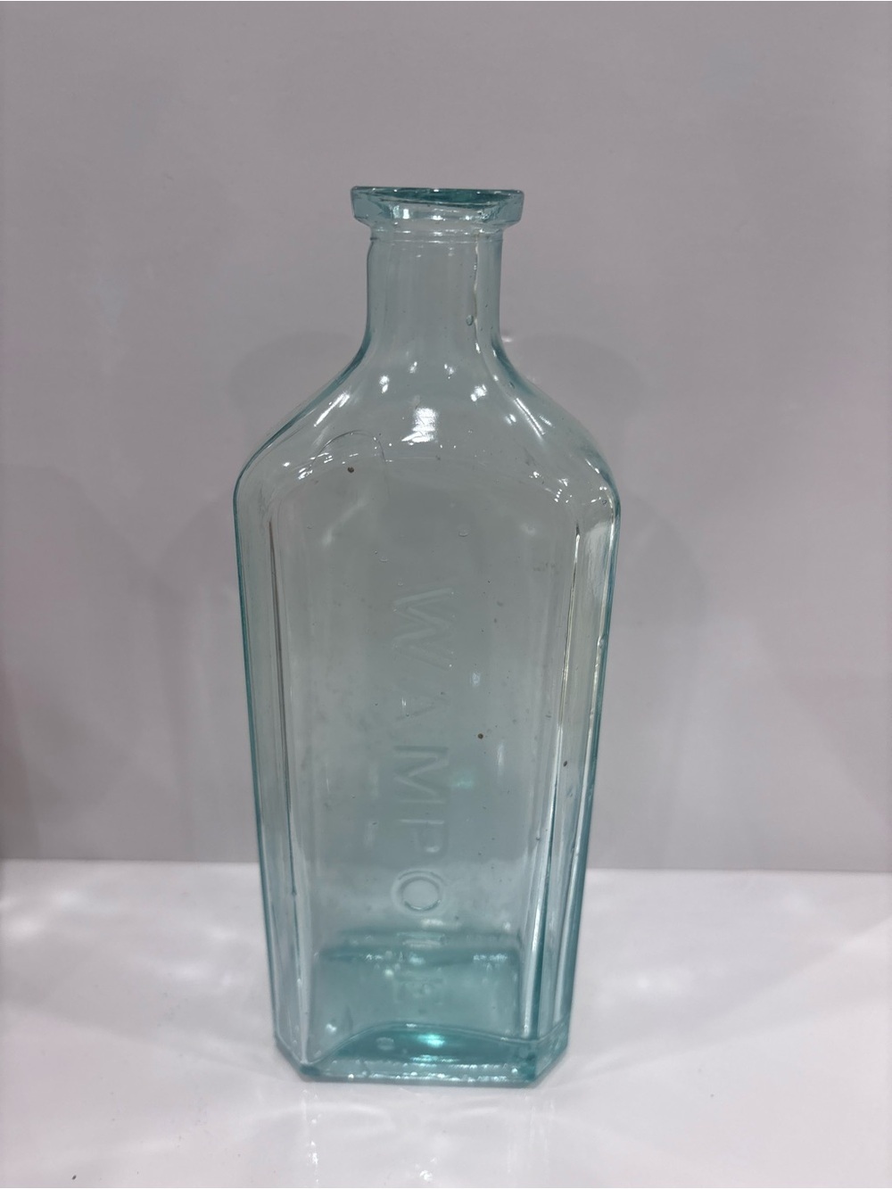 Vintage Wampole Aqua glass embossed medicine bottle c 1900-1925 pharmacy bottle